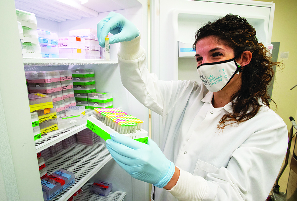 Alba Grifoni pulling samples out of a freezer