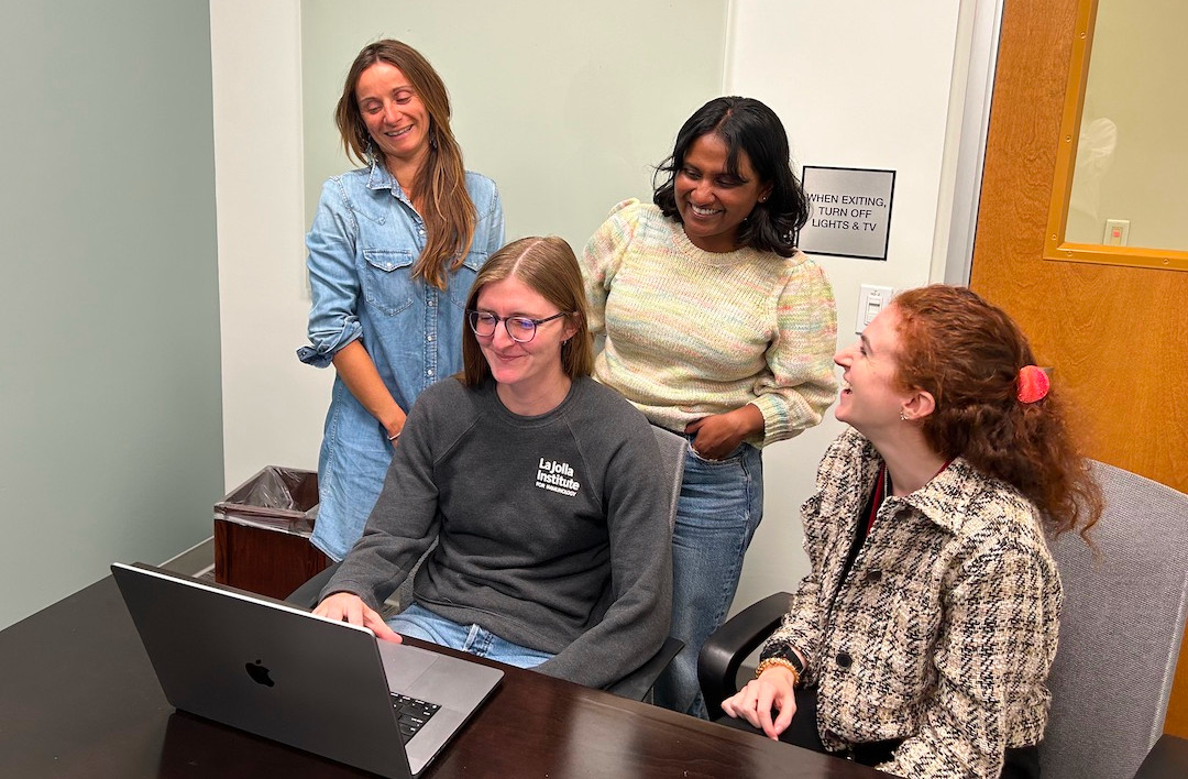 LJI scientists (left to right) Julie Burel, Ph.D., Sloan Lewis, Ph.D., Rashmi Tippalagama, Ph.D., and Eve Richardson, Ph.D., work to create a prediction model. (Image credit: Peters Lab, LJI) 