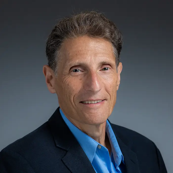 Portrait photo of Dr. Kronenberg. He is smiling at the camera