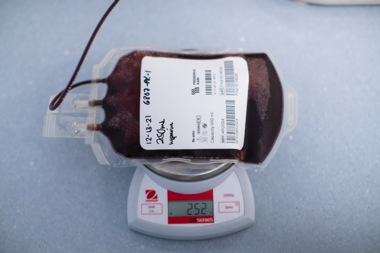 Photo of a blood donation bag on a scale