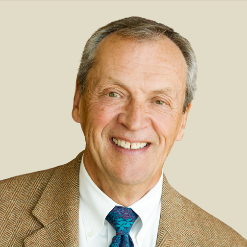 Portrait photo of Robert Dynes. He is smiling and looking at the camera
