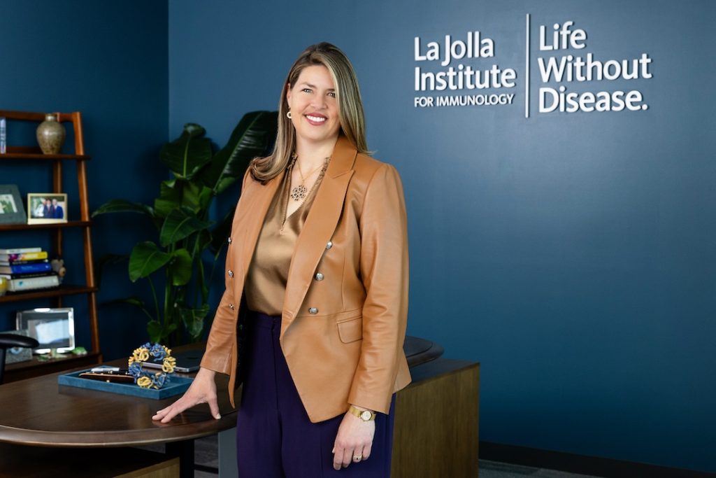 Portrait photo of Dr. Saphire. She is in her office. She is smiling at the camera