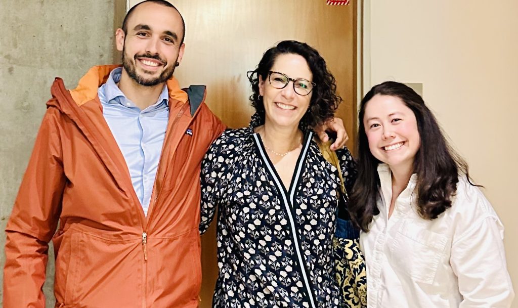 Posed group photo of three scientists. They are smiling and looking at the camera.